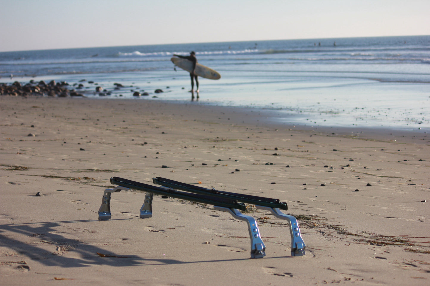 Surf racks angled view on beach Zinc plated clamps, green bars and black connecting stras